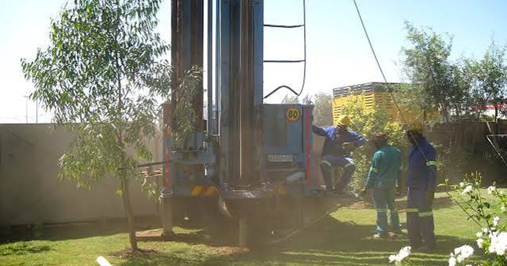 Borehole drilling rig on a Cape Town property with a filtration system for household borehole water